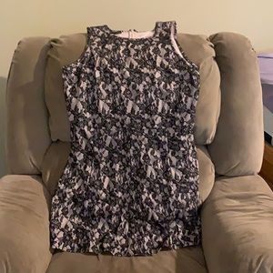 Beautiful Cream colored dress with black flower lace overlay.